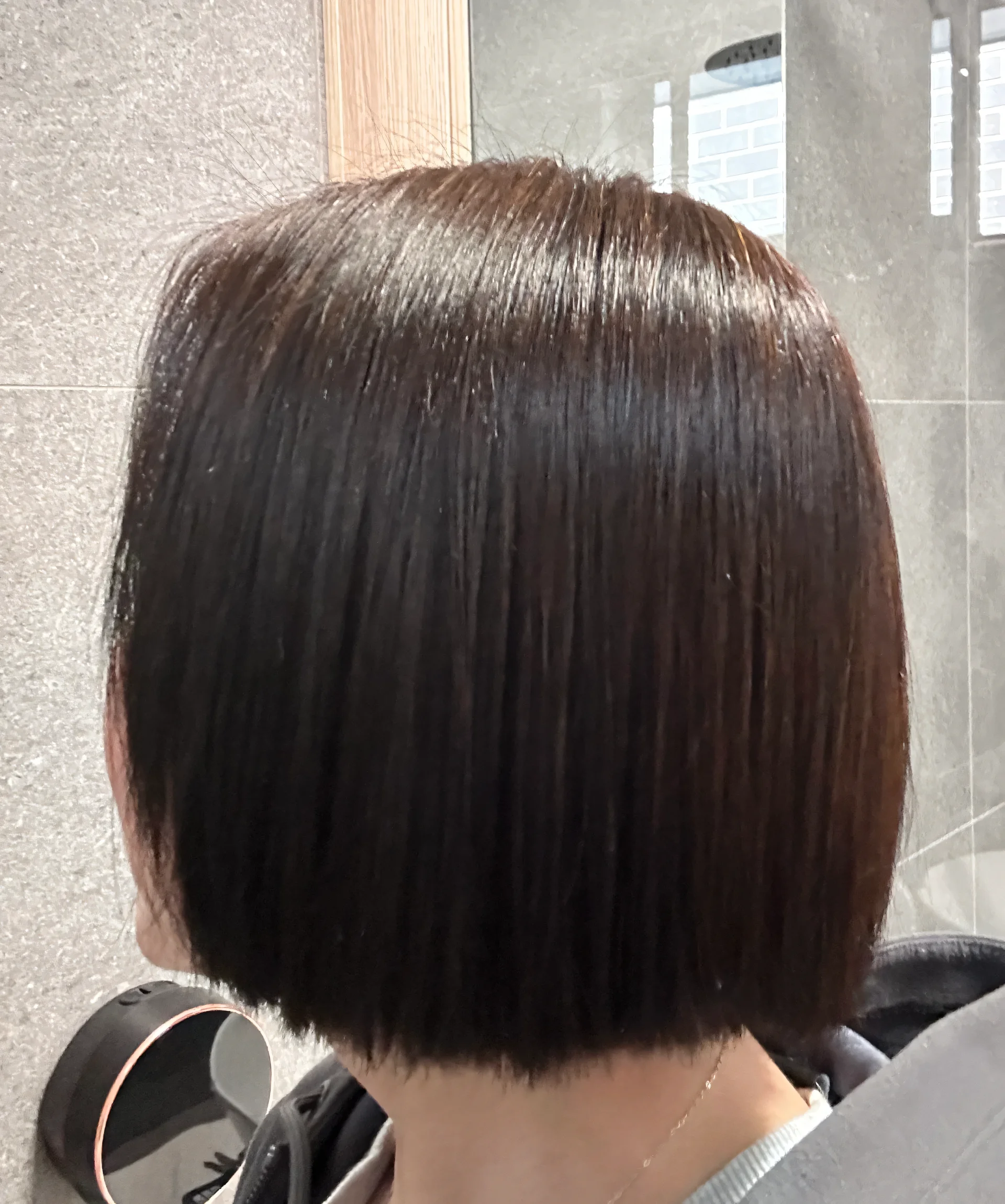 Sleek dark bob after treatment
